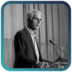 Image of man speaking at podium