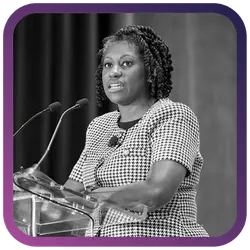 Image of woman speaking at podium