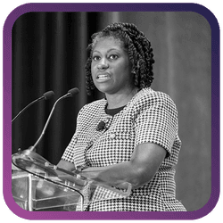 Image of woman speaking at podium