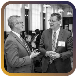 Image of two men talking