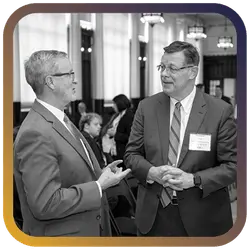 Image of two men talking