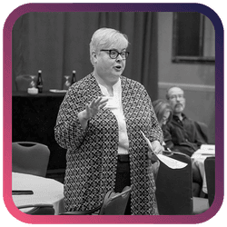 Image of a woman standing and speaking